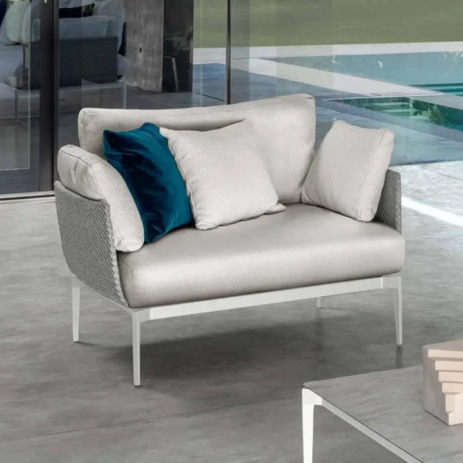 Stylish Talenti Leaf lounge chair with light aluminum structure, light gray weavings and dark blue velvet cushions crafted in Italy