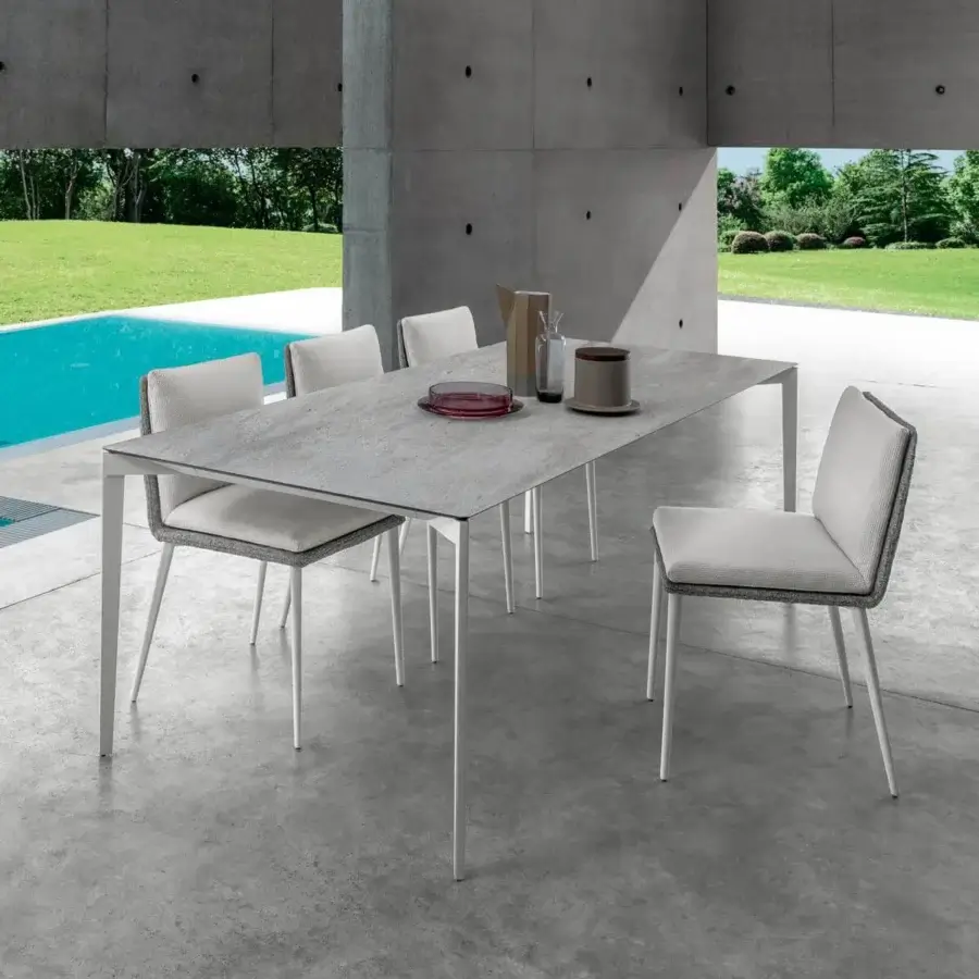 Elegant Talenti Leaf table with rectangular Vitter tabletop in textured gray and matte silver metal legs