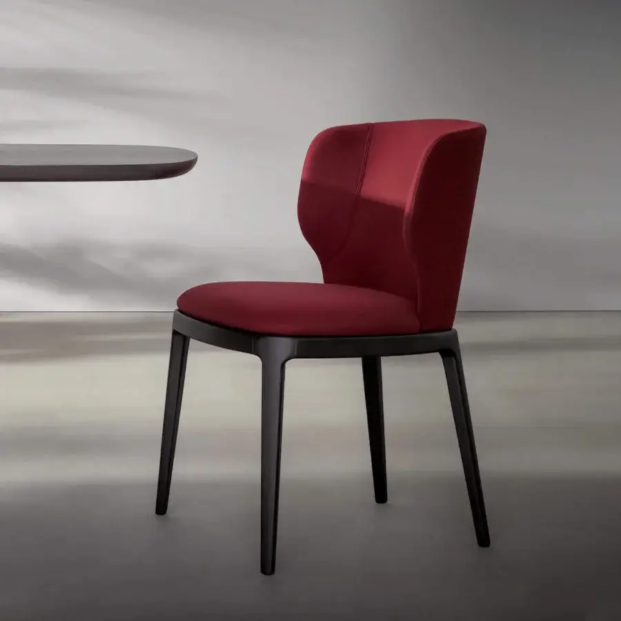 Superior Bonaldo Joy chair with dark red textile upholstery and a solid wood base built with slender legs