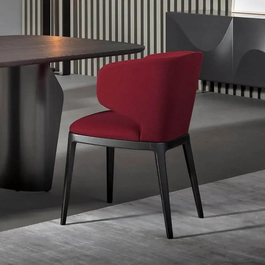 Elegant Bonaldo Joy chair with enveloping contours, deep red textile upholstery and a black-stained solid wood base