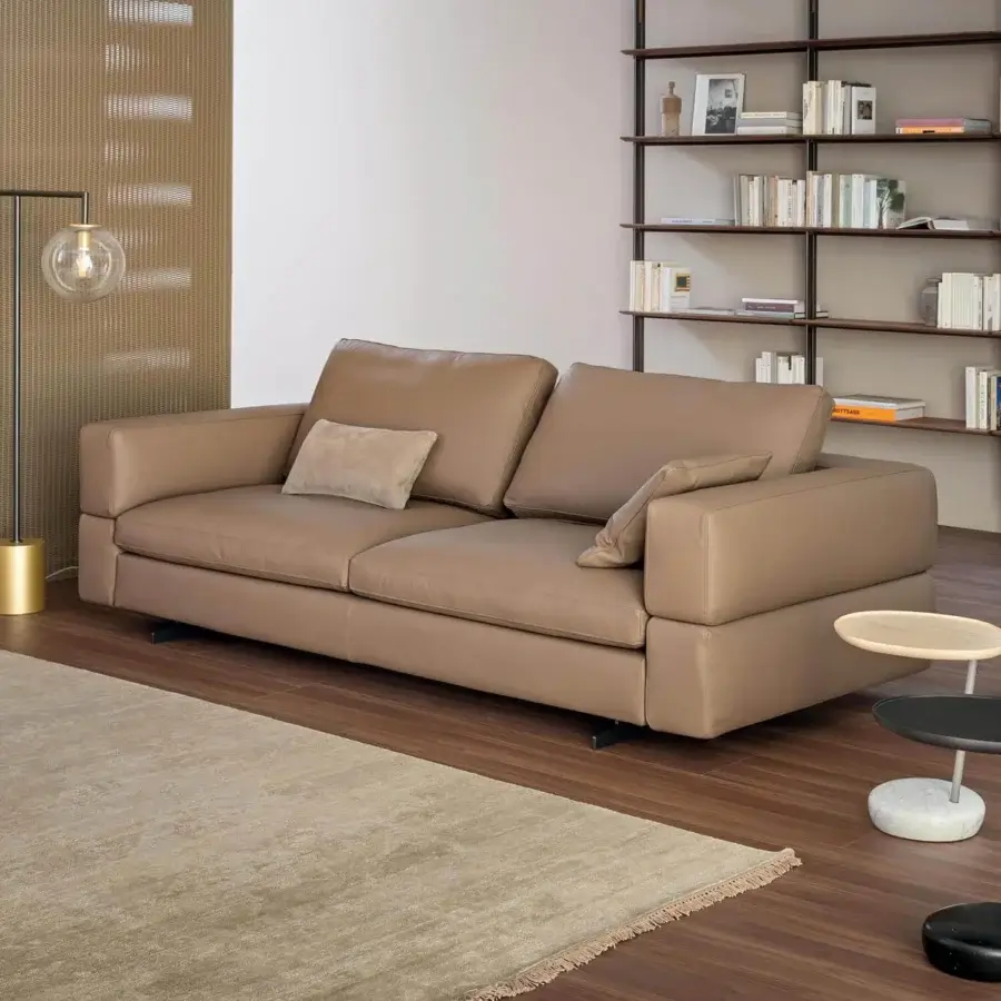 Elegant Bonaldo Ever More sofa with smooth light brown leather upholstery and low dark metal legs