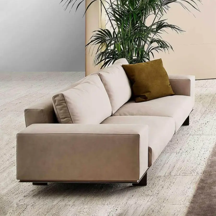 Distinguished Rugiano Memphis sofa upholstered in light beige textile with smooth matte finish and dark metal base with olive green cushion