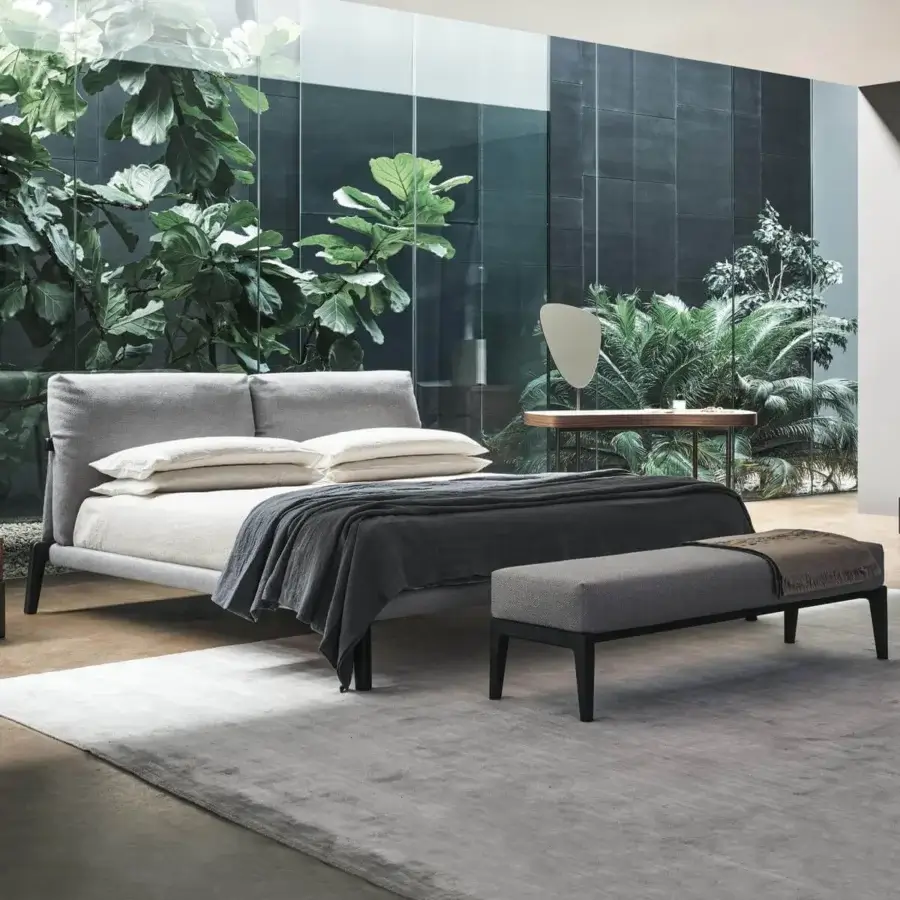 Superior Bonaldo Kriss bed with upholstered headboard and dark slender legs in light gray textile construction