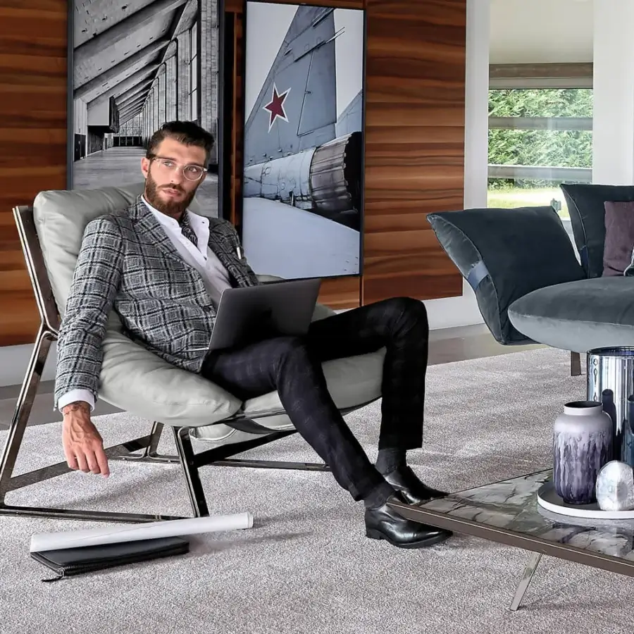 Elegant Arketipo Belair lounge chair with light grey fabric upholstery and Titanium metal structure