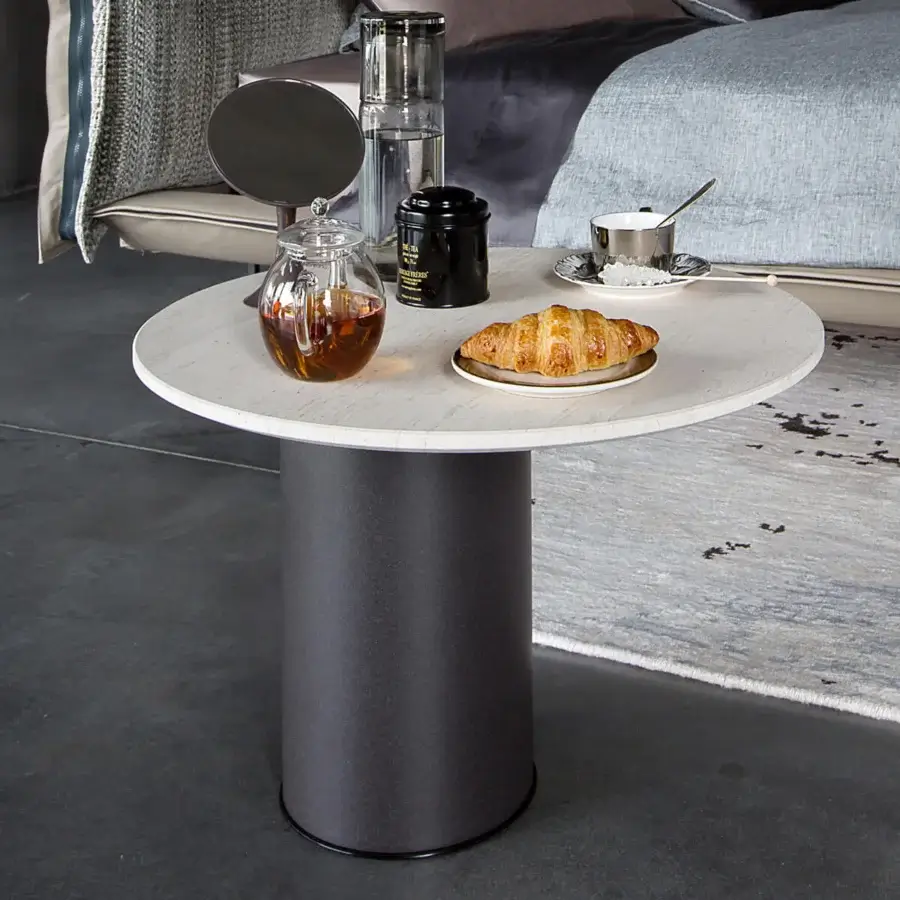 Elegant Arketipo Petra side table with a round sandstone tabletop and micaceous brown cylindrical base