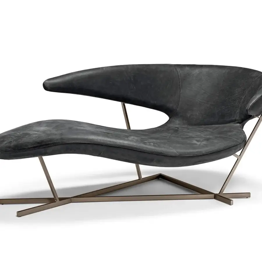 Elegant Arketipo Manta chaise lounge with dark gray textured leather and Varnished Micaceaus Brown metal base