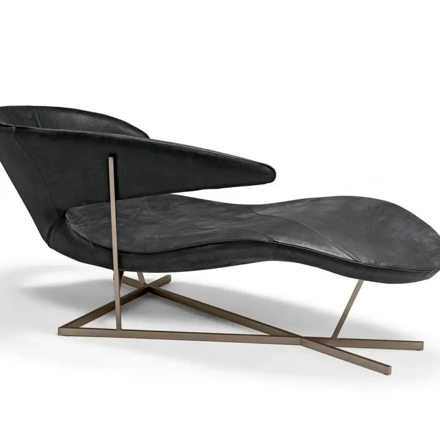 Distinguished Arketipo Manta chaise lounge with dark textured textile upholstery and Varnished Micaceaus Brown geometric metal base
