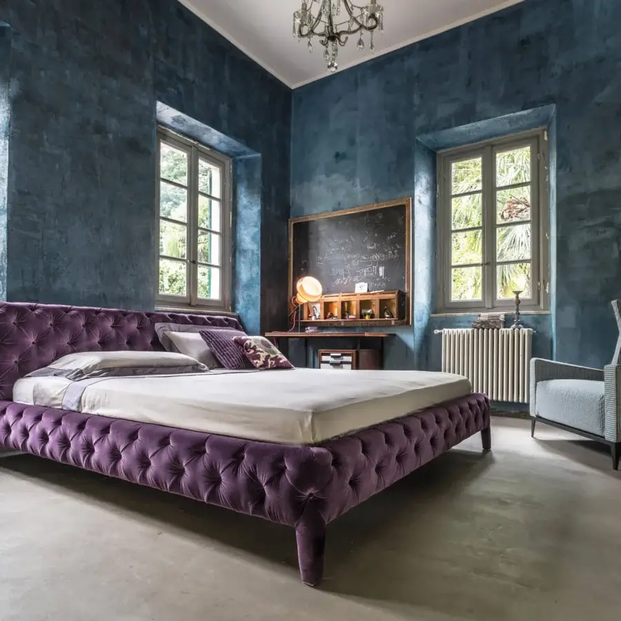 Sumptuous Arketipo Windsor Dream bed with deep purple velvet upholstery and button-tufted design