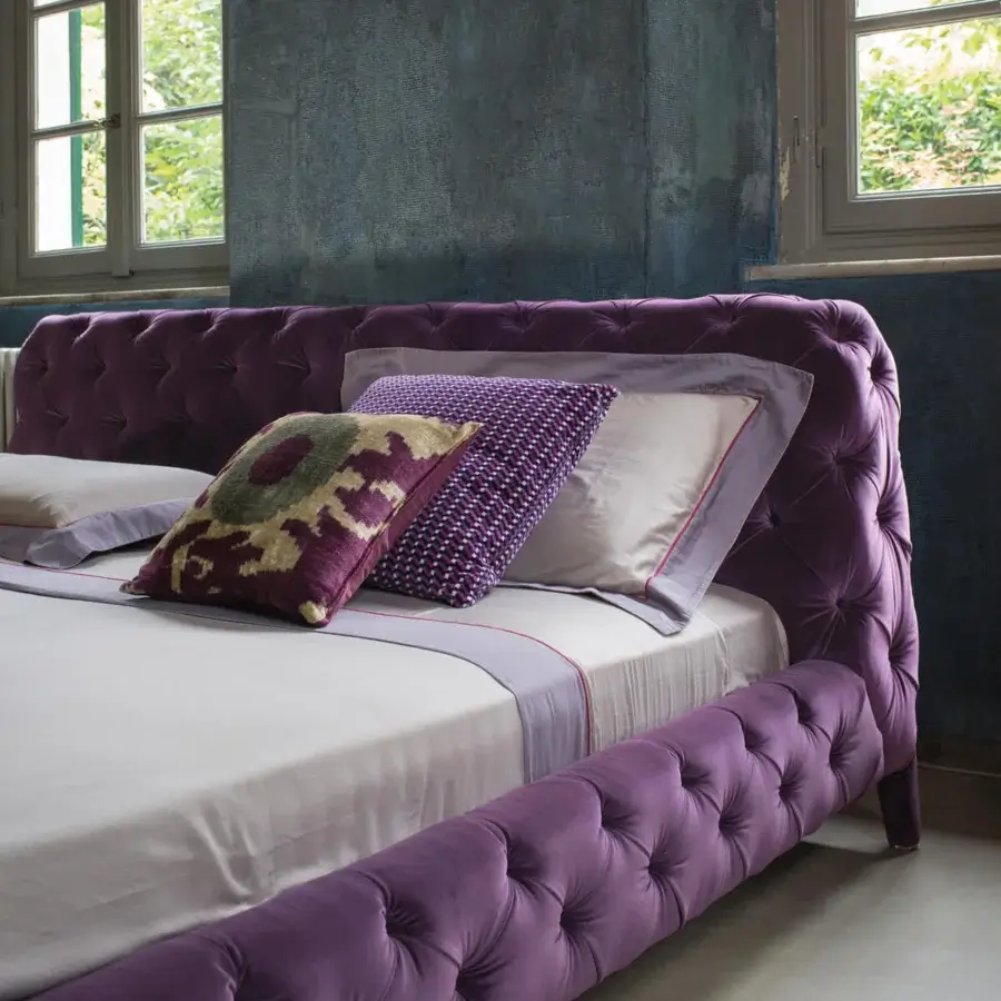Elegant Arketipo Windsor Dream bed in vibrant purple velvet with handcrafted tufted rhombus patterns across its structure