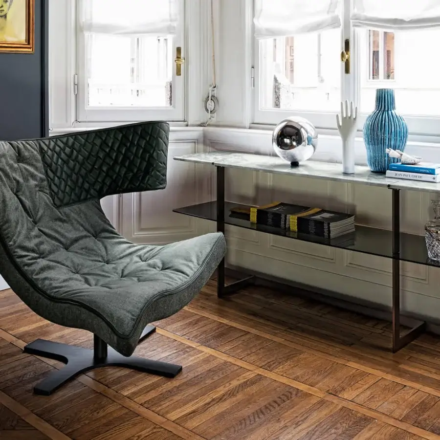 Exceptional Arketipo Roxy lounge chair with sinuous shape and sophisticated gray quilted textile featuring a matte finish