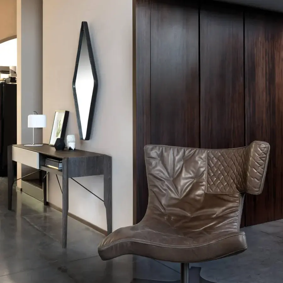 Superior Arketipo Roxy lounge chair in supple brown leather with quilted upper backrest and sinuous shape