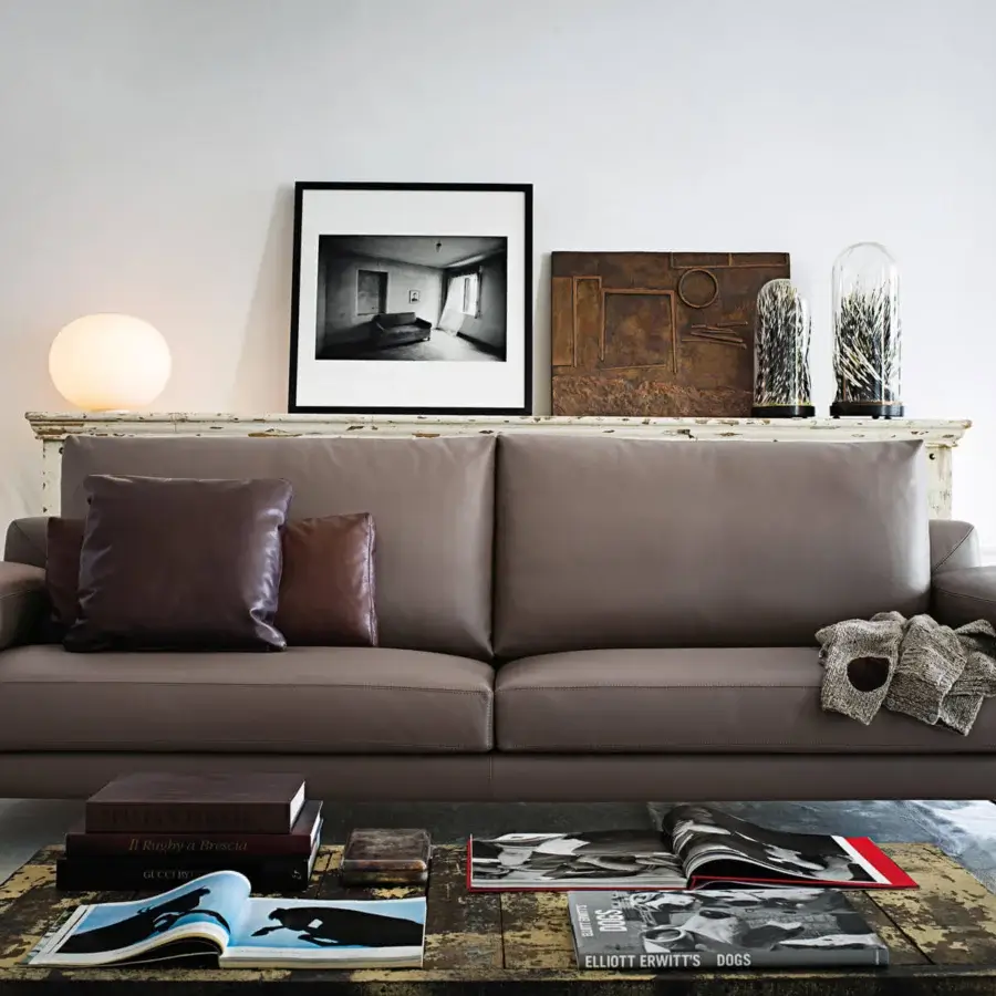 Superior Arketipo Ego sofa with carved geometric lines and brown textile upholstery supported by micaceous brown stained metal feet