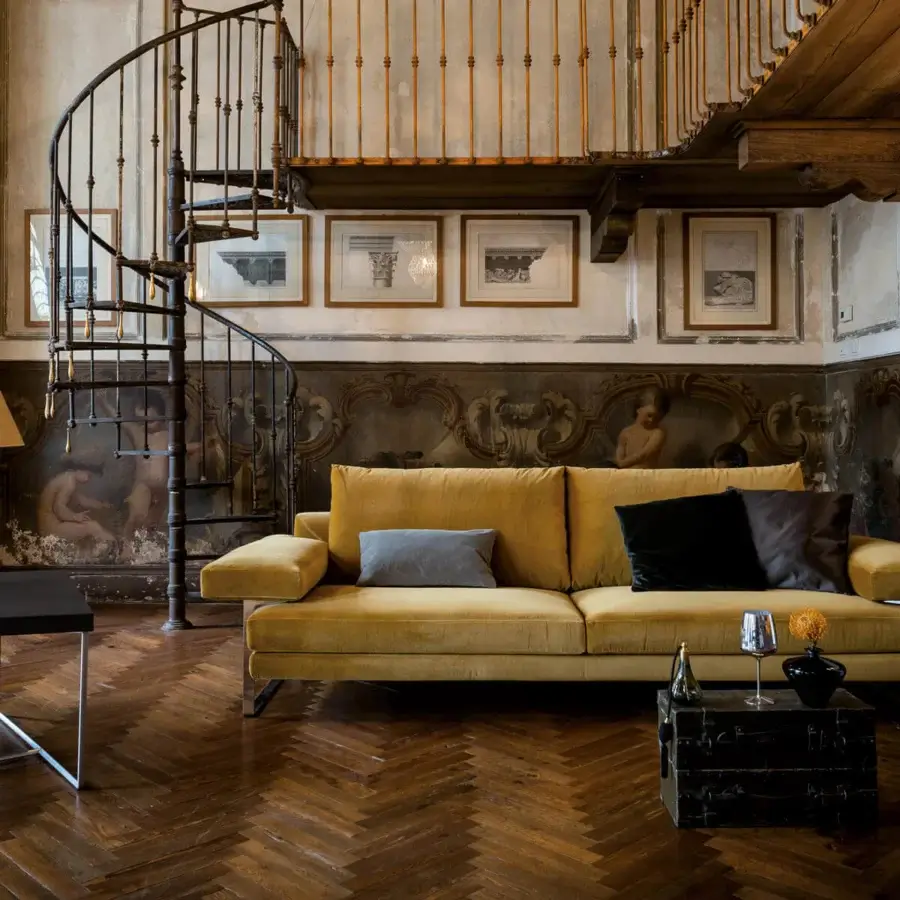Exceptional Arketipo Ego sofa with carved geometric lines upholstered in mustard yellow plush fabric and micaceous brown stained metal feet