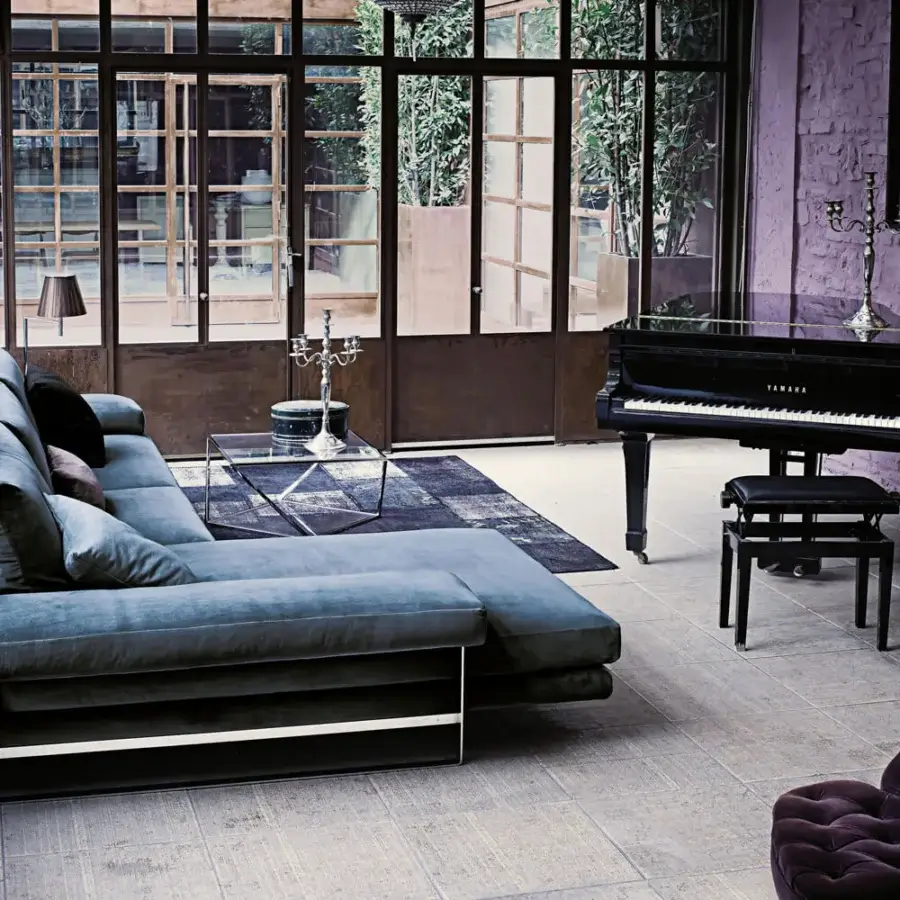 Distinguished Arketipo Ego sectional with carved geometric lines upholstered in muted teal textile and micaceous brown stained metal base
