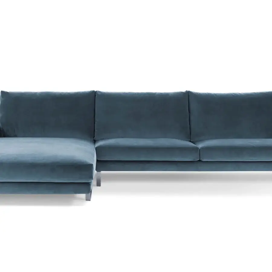 Lavish Arketipo Ego sectional with carved geometric lines upholstered in muted blue textile with a smooth matte finish