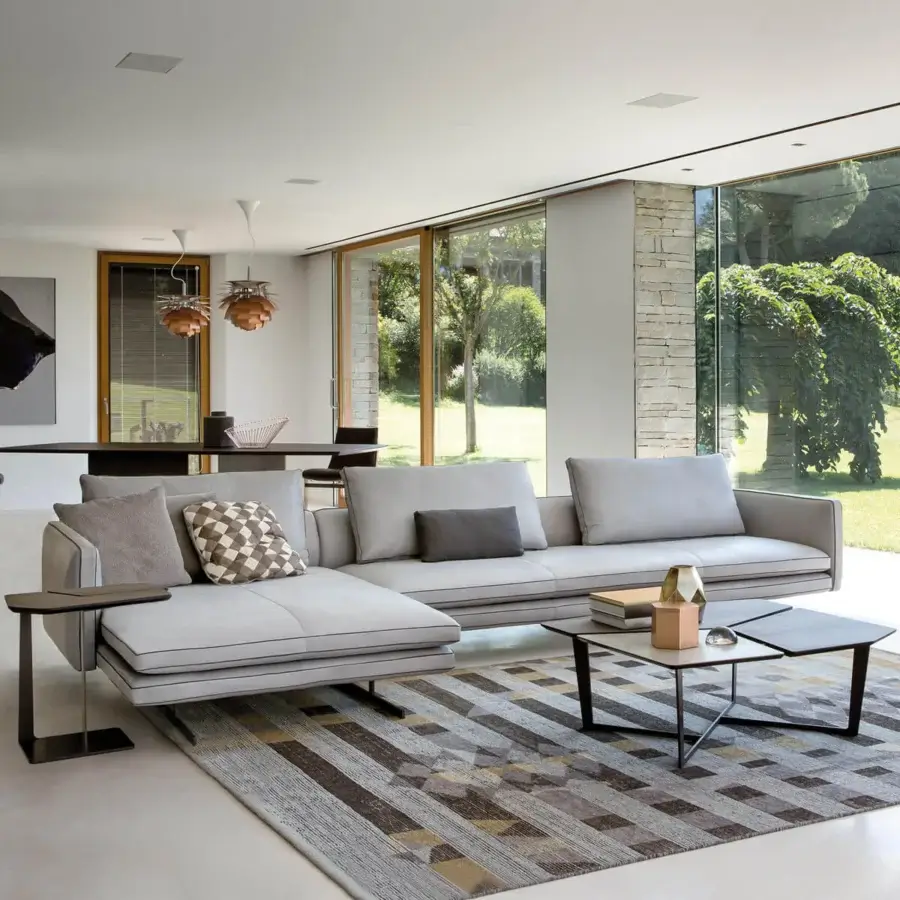 Distinguished Arketipo Moss sectional with light gray textile upholstery and dark metal base showcasing geometric forms with thin trim