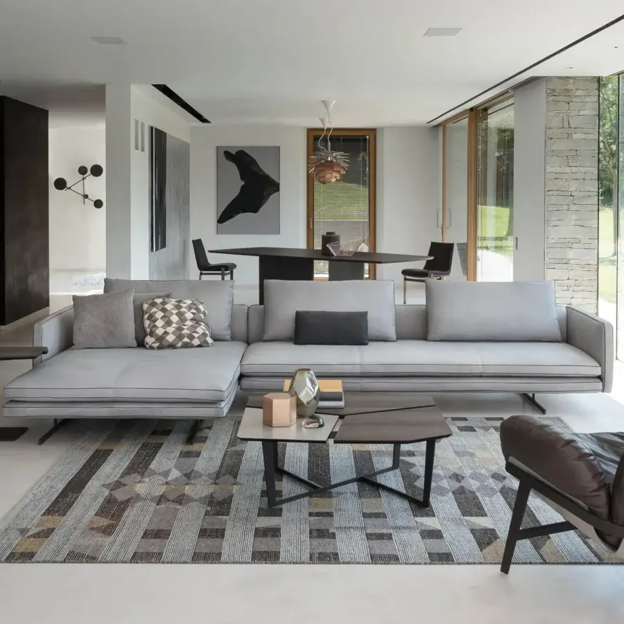 Lavish Arketipo Moss sectional with light gray textile upholstery and slender dark base construction