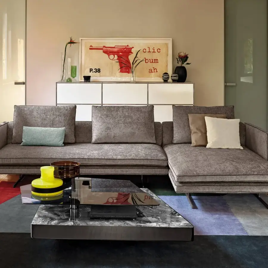 Superior Arketipo Moss sectional in uniformly gray textile upholstery with delicate light piping outlining cushions