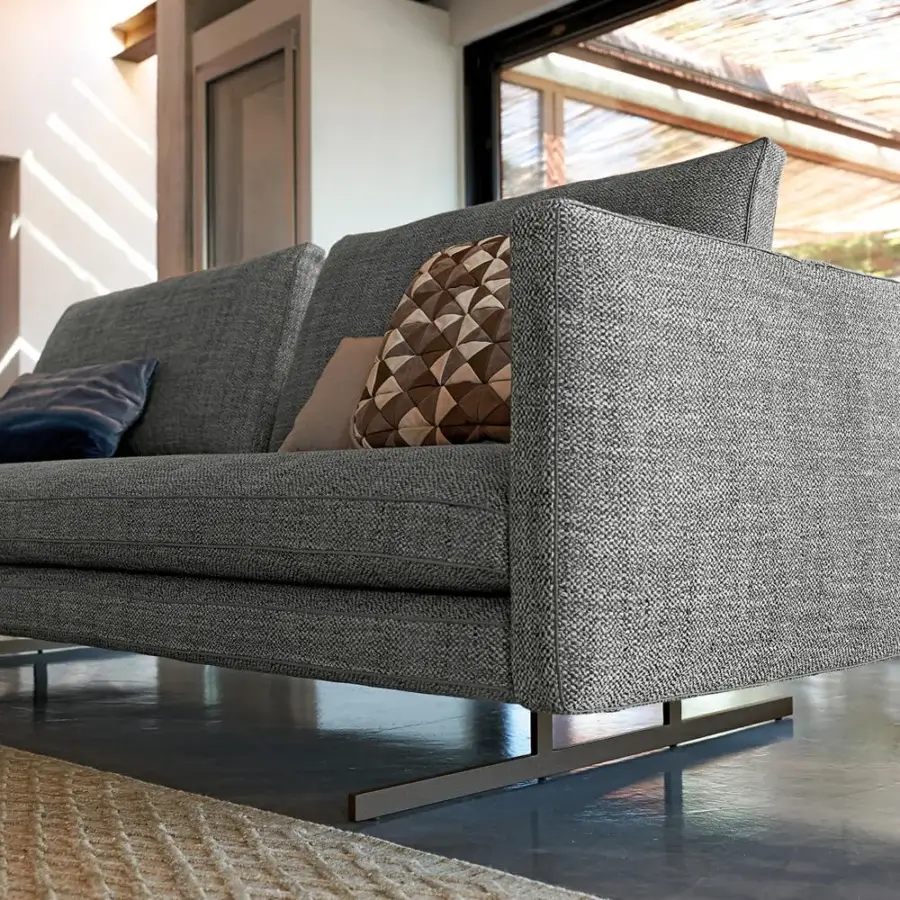Distinguished Arketipo Moss sectional in textured gray textile upholstery with sleek matte metal base and light piping detail