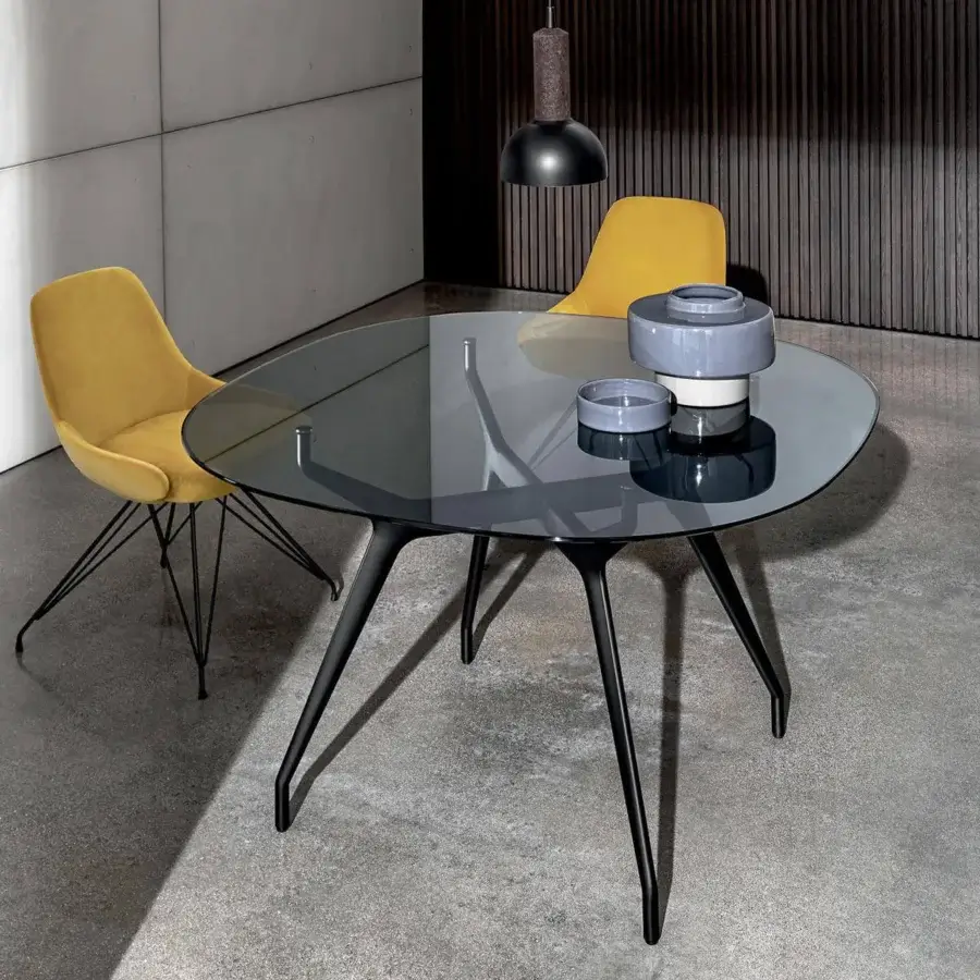Distinguished Sovet Italia Arkos table with dark tinted glass top and curved aluminum legs crafted with a dark finish