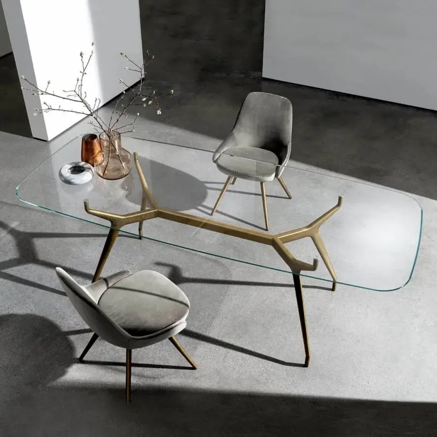Superior Sovet Italia Arkos table with rounded glass top and satin golden die-cast aluminum X base
