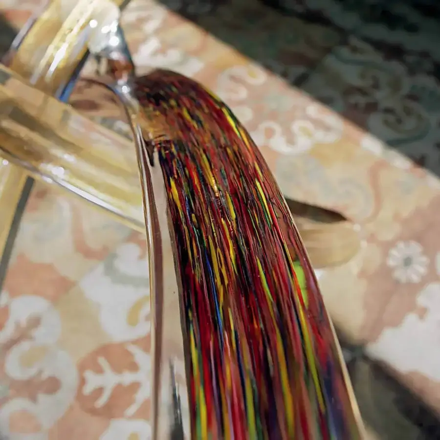 Superior Reflex Fili D'Erba table with curved form, vibrant streaks of red, yellow, and blue in glass, plus Calcedonio Murano glass base