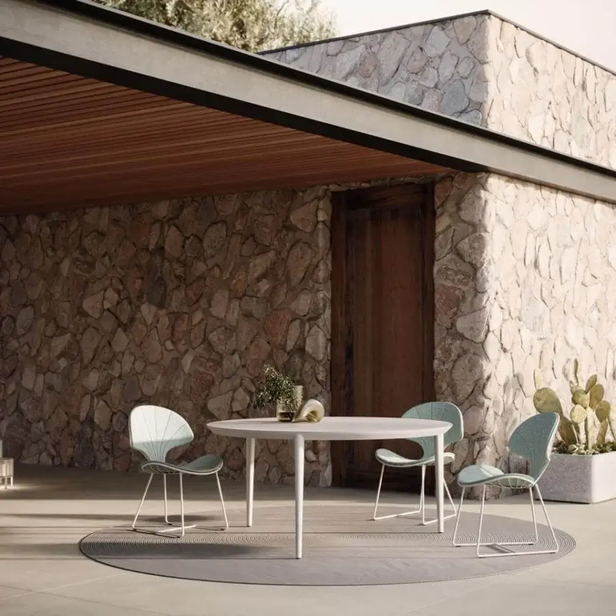 Inviting Royal Botania Ostrea chair in white metal with a light teal textile seat and backrest, an organic design
