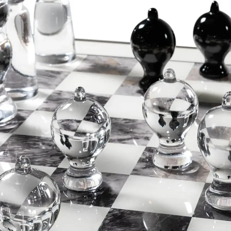 Elegant Reflex Tau Steel Scacchi table with a marble glass chessboard top and bronze finished wooden cylinder base