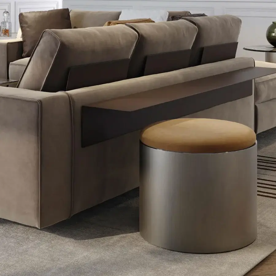 Refined Reflex Tau Steel ottoman with golden-brown textile and satin bronze cylindrical base