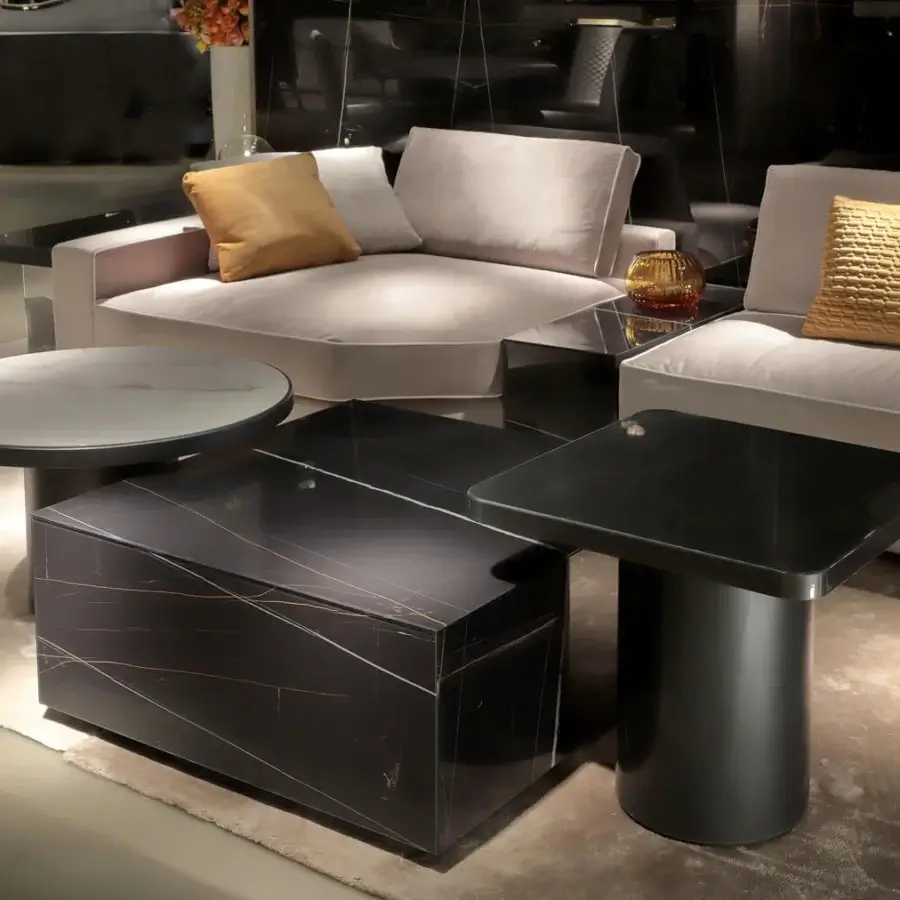 Elegant Reflex Tau Steel coffee table with light marble glass top and cylindrical dark brass satin finish