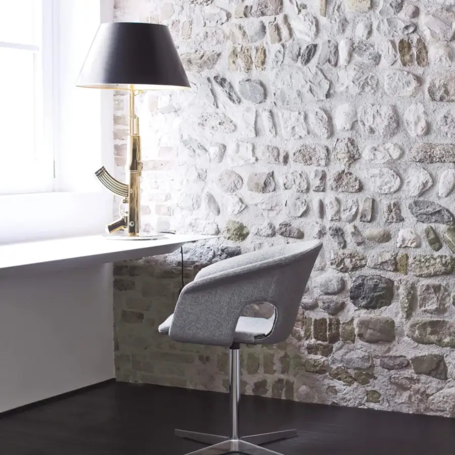 Stylish LaCividina Bennett armchair with plywood shell and uniform gray textile upholstery, built with a black epoxy powder paint metal base