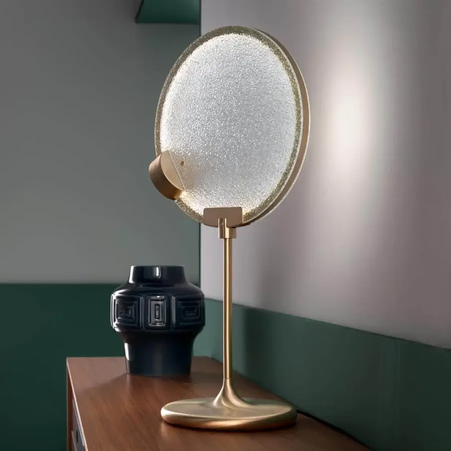 Distinguished Masiero Horo table lamp with prism glass diffuser encased in brass-colored metal structure and textured translucent shade