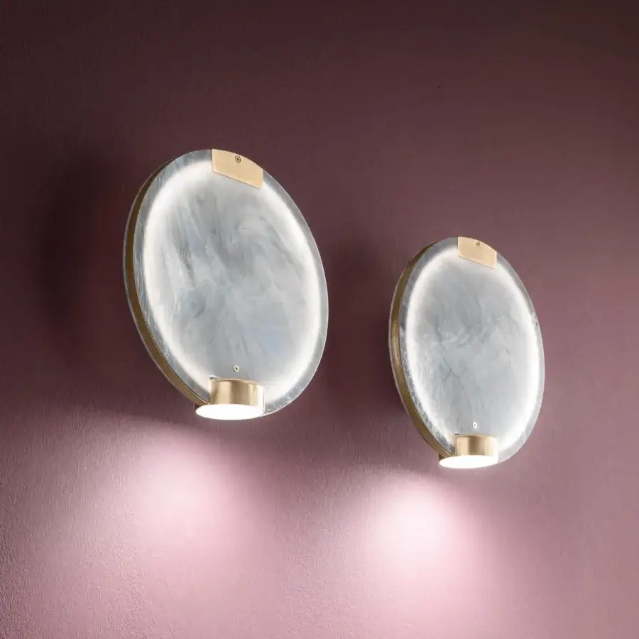 Superior Masiero Horo wall lamp with metal structure and swirling marbled light grey glass diffuser emitting a warm glow