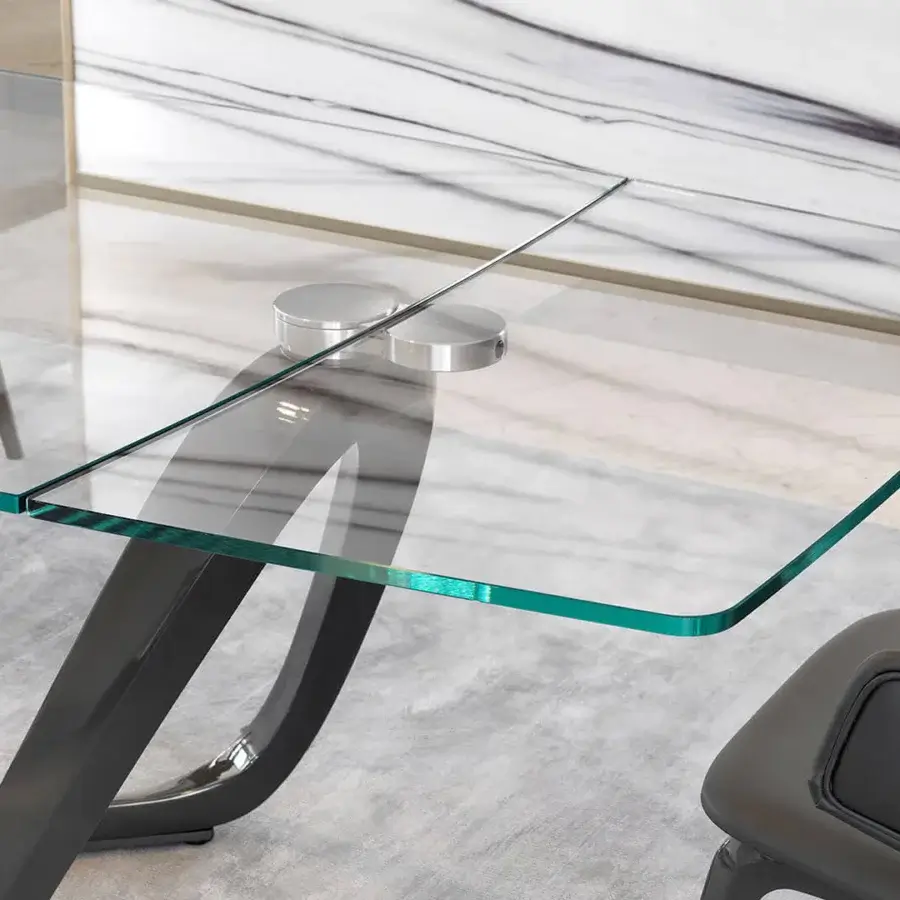 Exceptional Reflex Segno table with extra-clear glass top and looping dark gray glossy base crafted for contemporary dining spaces