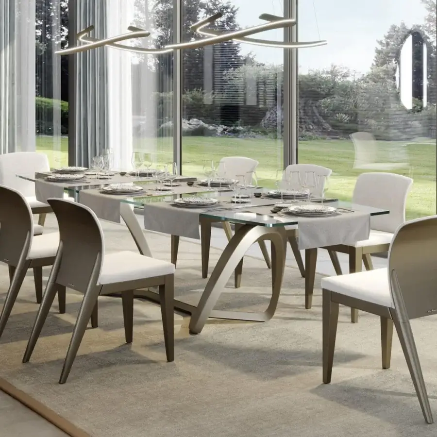 Elegant Reflex Segno table with transparent glass top and sculptural base crafted in mixed materials with bronze metal support