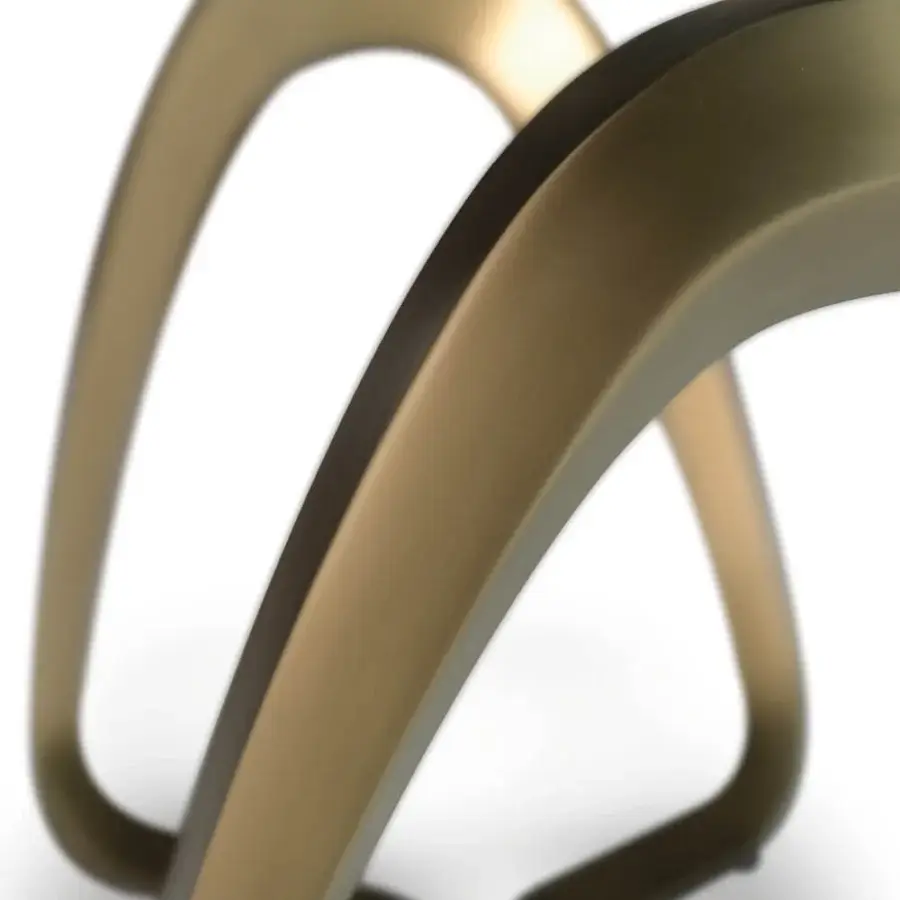 Superior Reflex Segno table with geometric silhouette, bronze metal support and sleek black surface crafted in a mixed material base