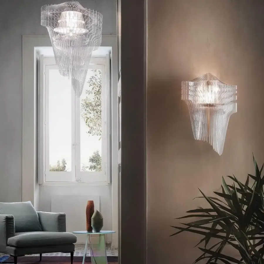 Architectural Slamp Aria wall lamp in transparent Lentiflex® and Cristalflex® with a tiered flowing structure