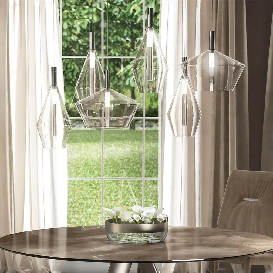 Exceptional Reflex 24 Gradi suspension lamp crafted in transparent blown glass and polished steel exhibiting luminous design