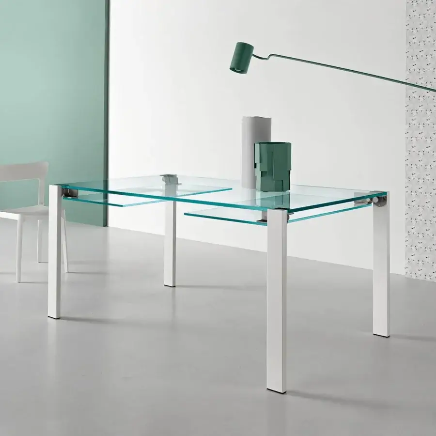 Distinguished Tonelli Design Livingstone table with clear glass tabletop and matte white metal legs built with a stainless steel zipper mechanism