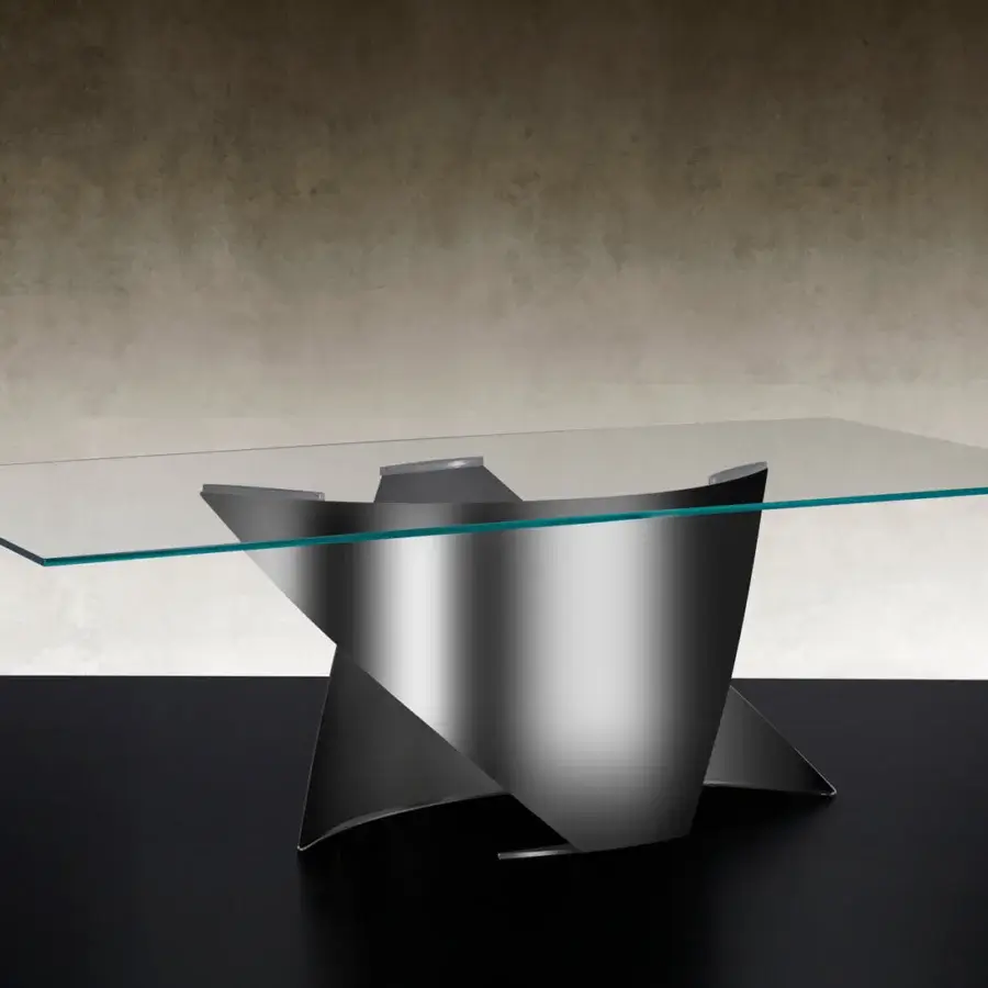Captivating Reflex Vele table with a transparent tempered glass top and sculptural titanium finished metal base