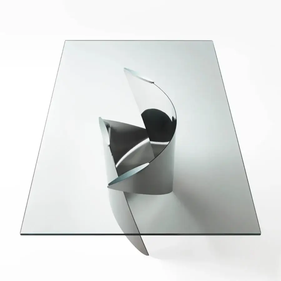 Elegant Reflex Vele table with a rectangular tempered glass top and curved titanium metal base
