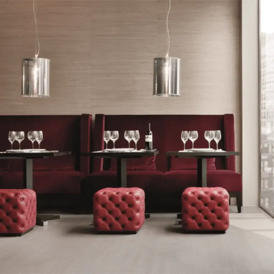 Distinguished Porada Alcide ottoman with vibrant red textile upholstery and button tufting presenting a contemporary aesthetic
