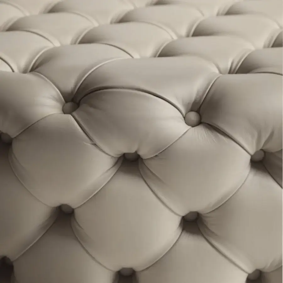 Lavish Porada Alcide ottoman with light brown leather and button tufting presents comfortable support