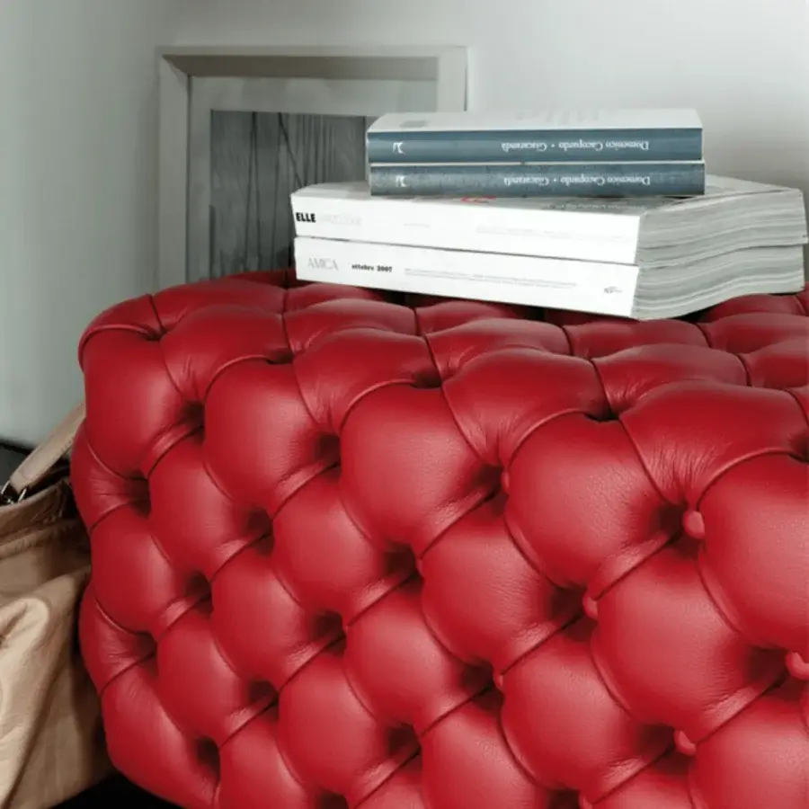 Exceptional Porada Alcide ottoman with vibrant red leather upholstery and deep button tufting presents a rounded form