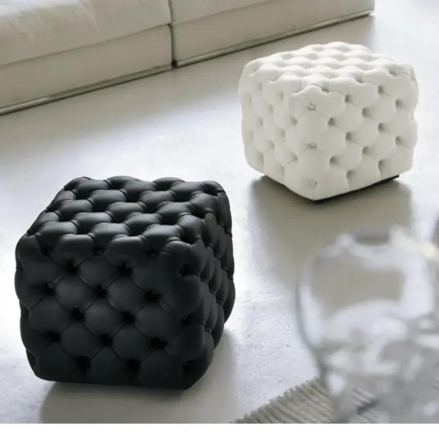 Sophisticated Porada Alcide ottoman with black leather upholstery and classic button tufting