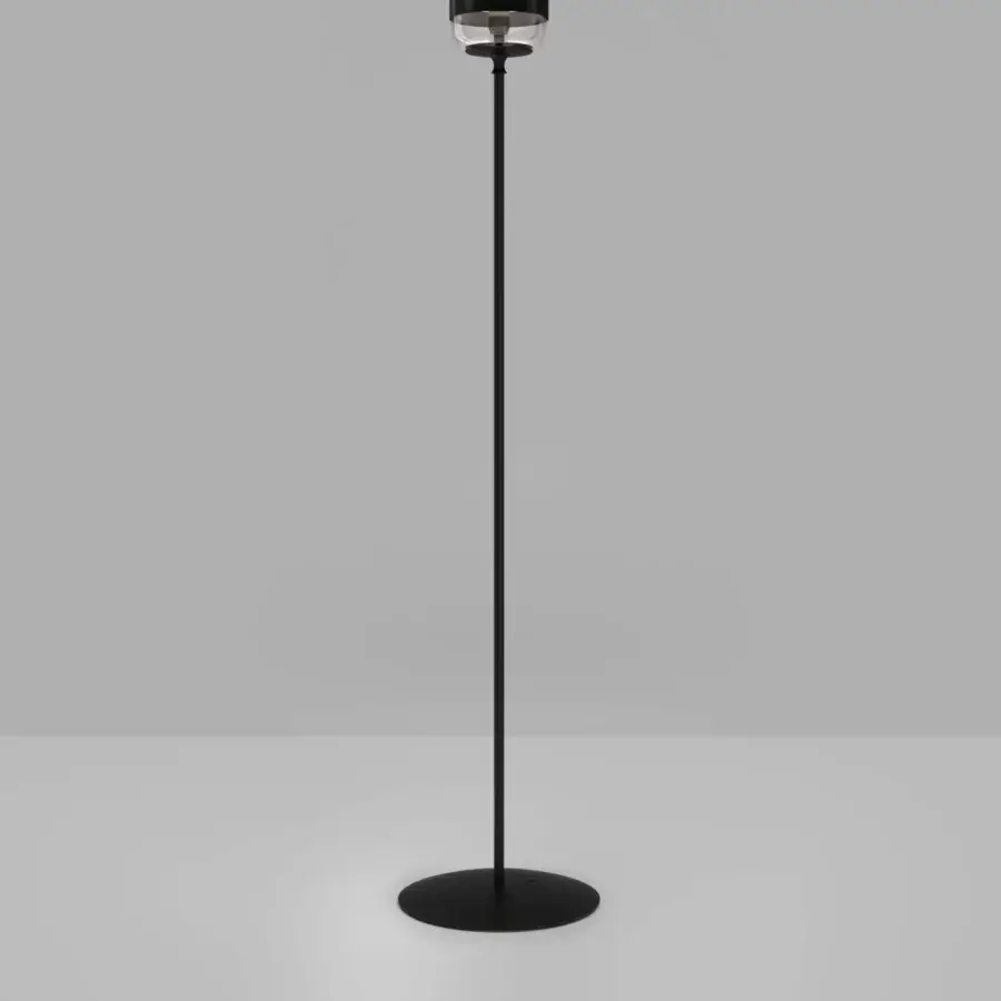 Elegant Vistosi Futura floor lamp with a blown glass shade in transparent, black, and white with a slender black metal pole