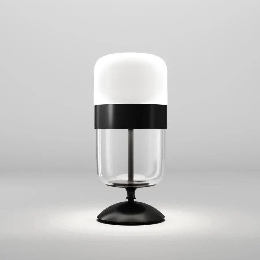 Exclusive Vistosi Futura table lamp crafted in hand-blown glass with a sleek metal ring and contrasting black base