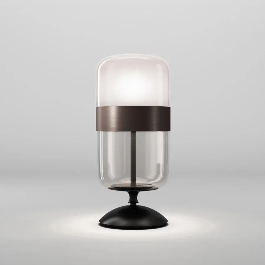 Exclusive Vistosi Futura table lamp crafted in hand-blown glass with a bronzed metal ring and matte black base
