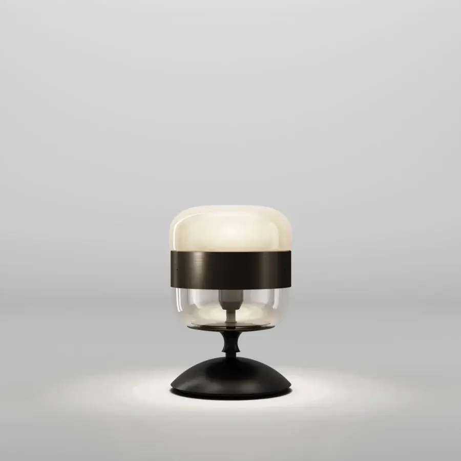 Exceptional Vistosi Futura lamp crafted in hand-blown glass with a transparent section and cream-colored opaque glass top with a dark metal ring