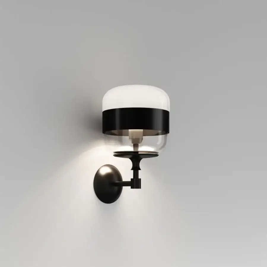 Elegant Vistosi Futura wall lamp with rounded silhouette crafted in translucent and opaque white blown glass with a matte metal base